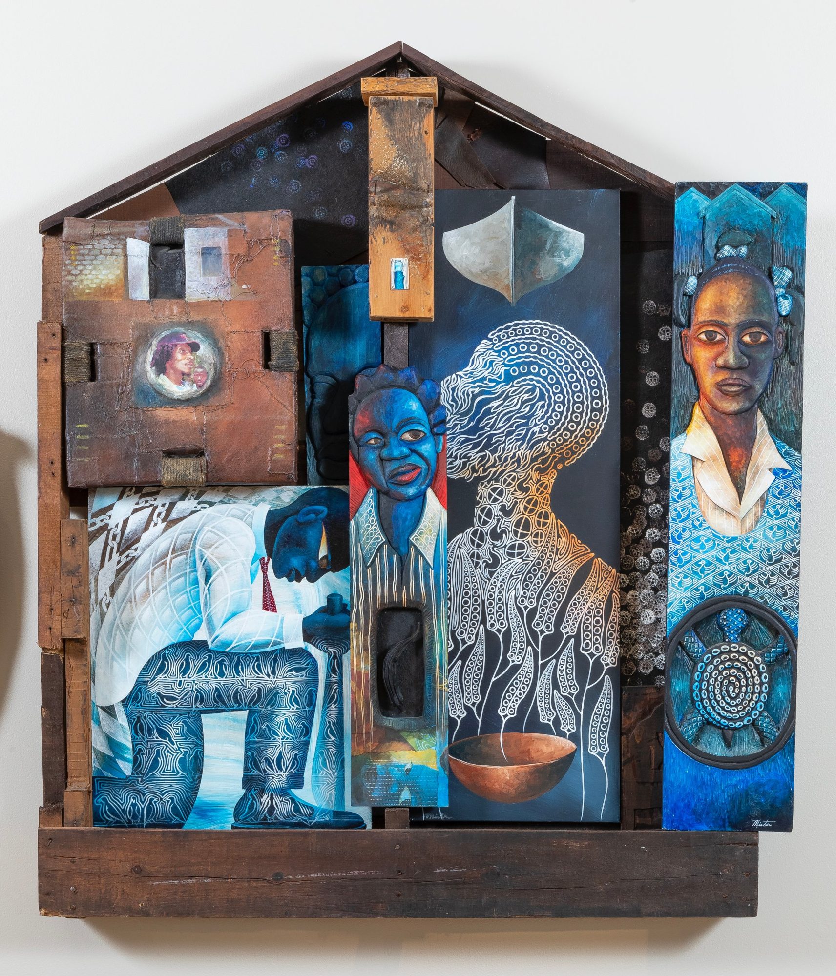 House-shaped assemblage with a kneeling figure, shown at the Farnsworth Art Museum